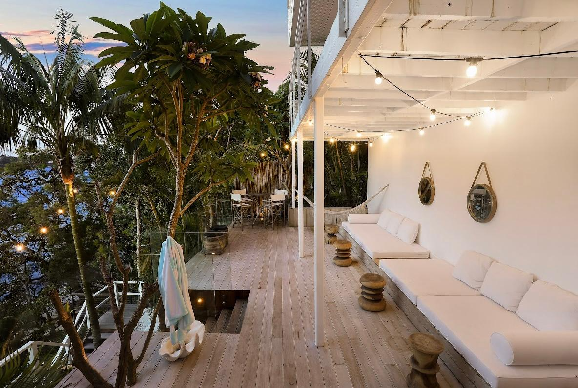 Evening deck with string lights and ocean views
